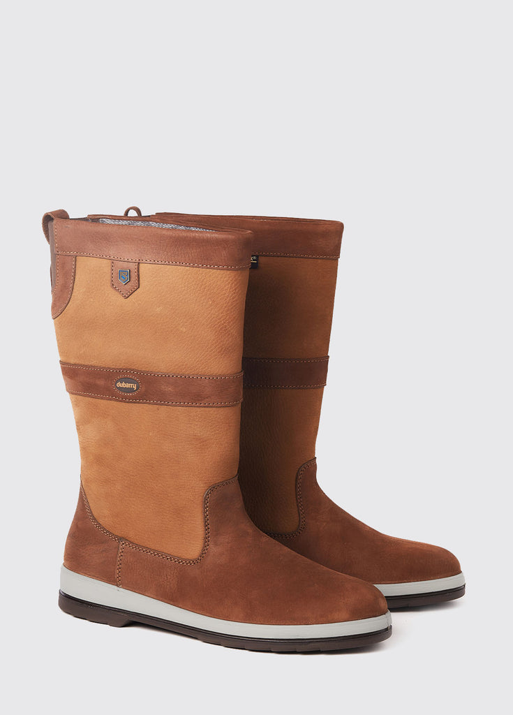 Pair of Ultima Sailing Boots in brown on a grey studio background.