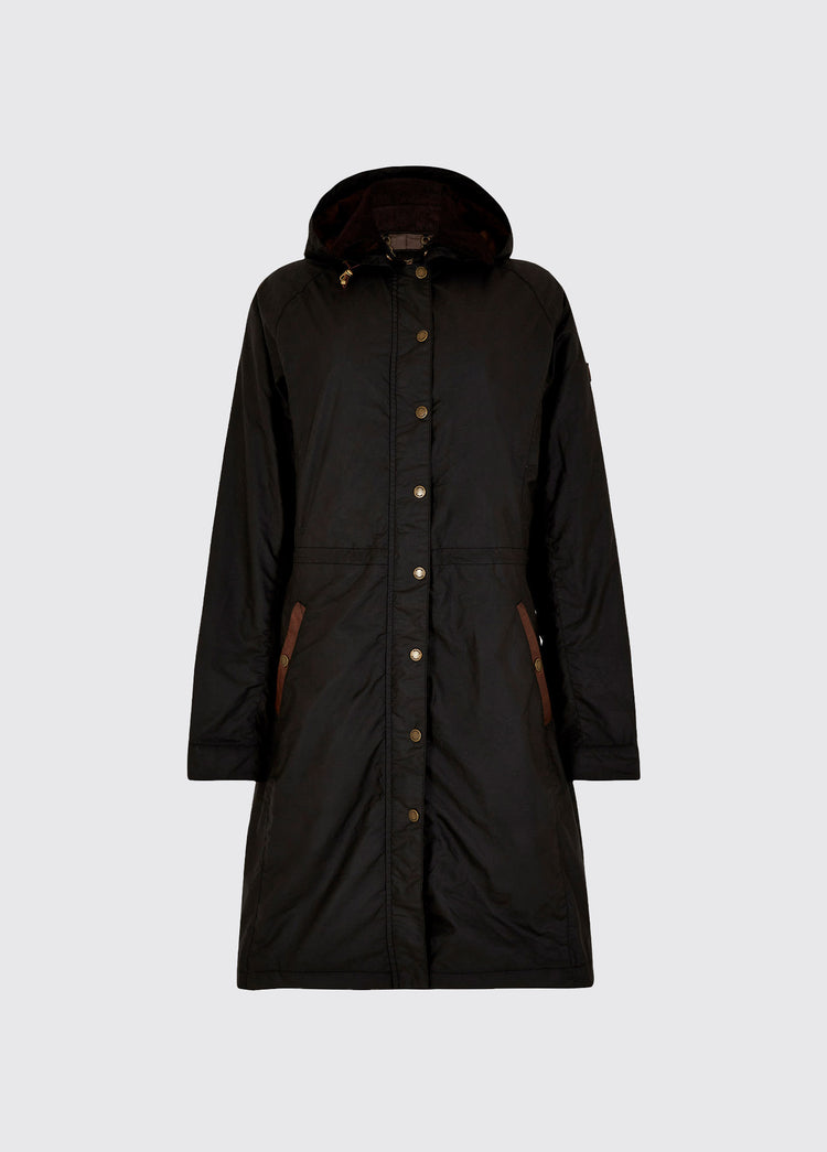 A black Dubarry Redington Wax coat, longer length coat with  full zip. Model is wearing a light coloured jumper underneath. 